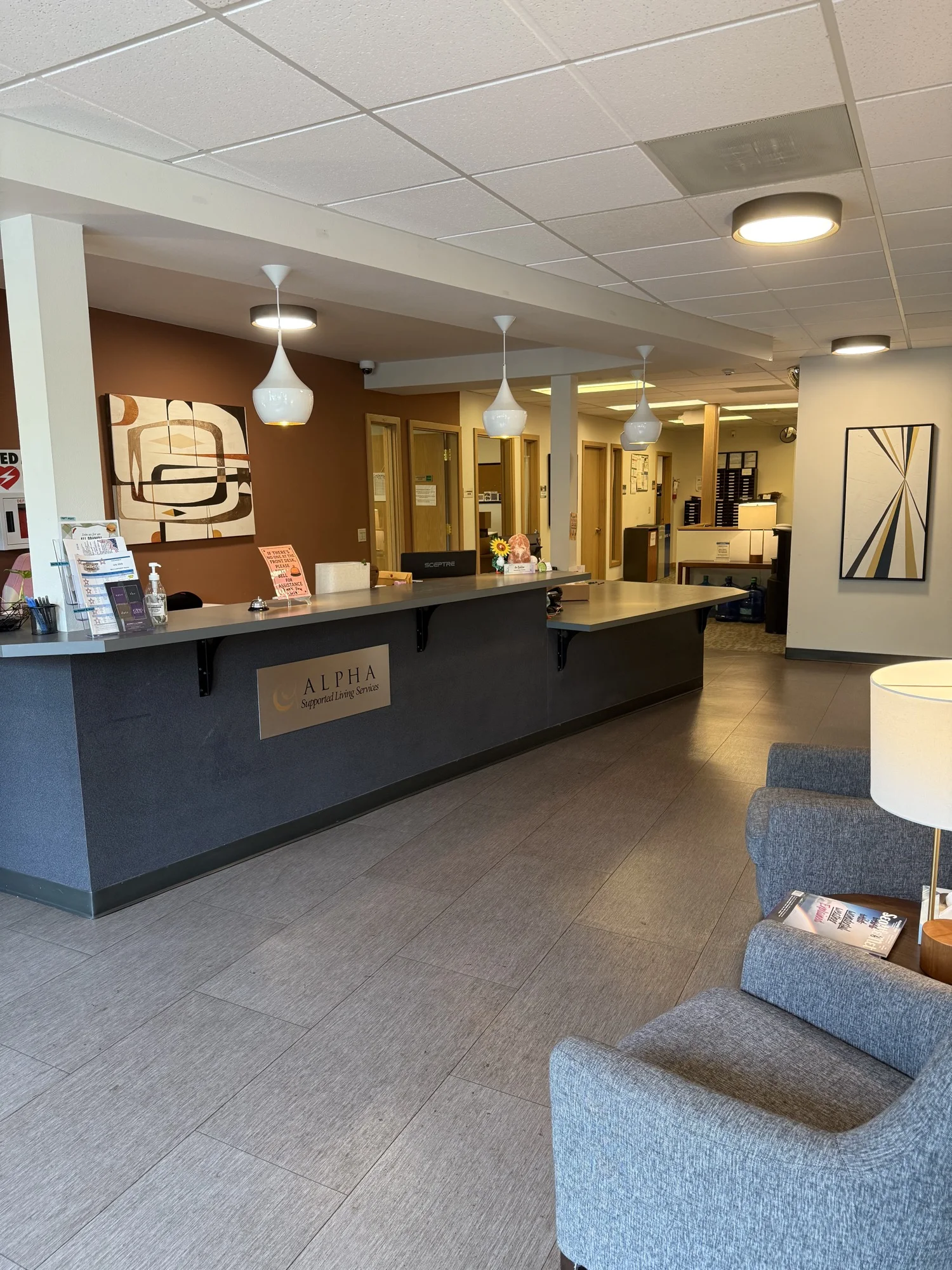 Reception area with seating and pendant lights